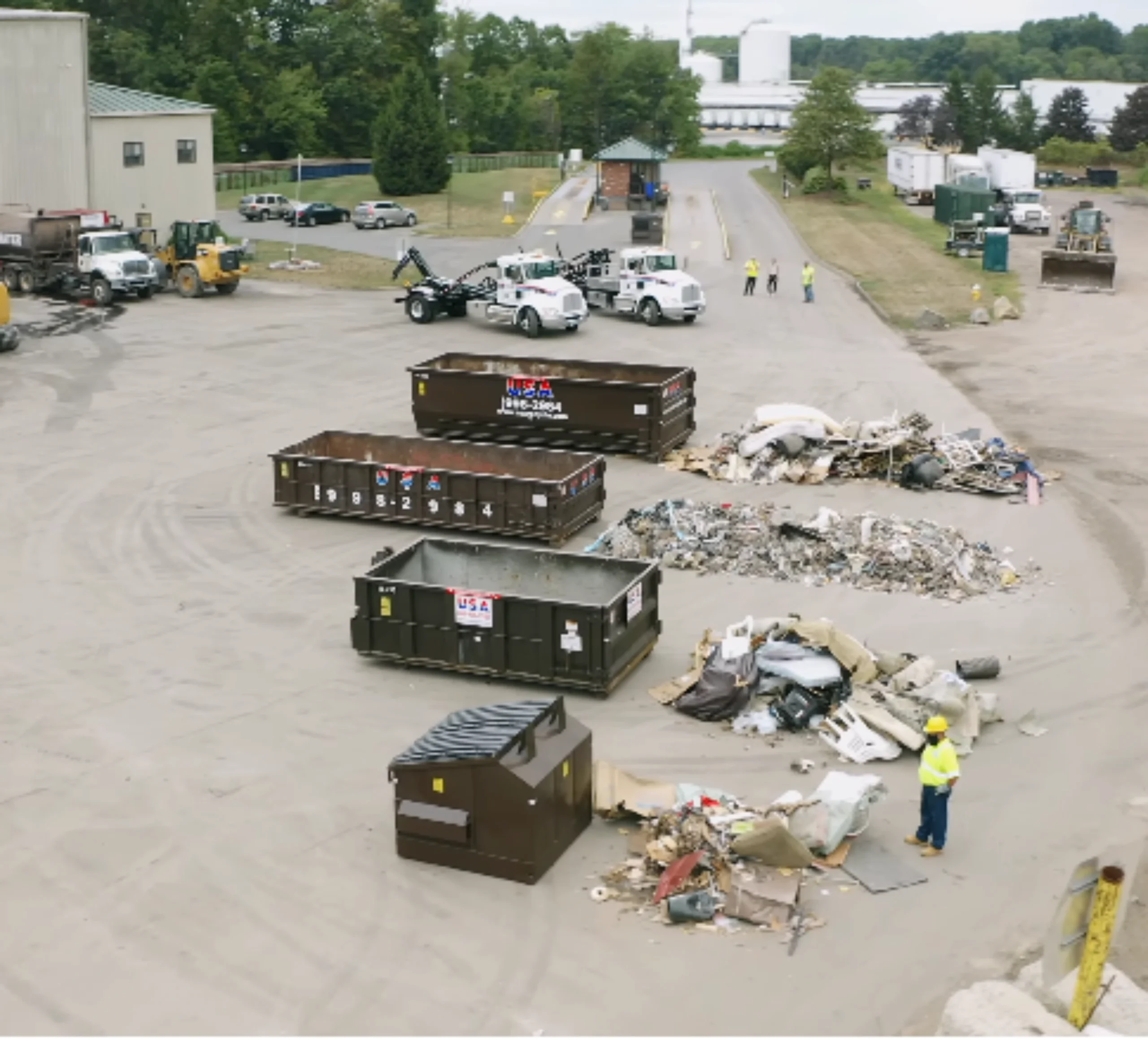 Multiple roll-off dumpster sizes at disposal facility — 10, 20, and 30 yard containers compared