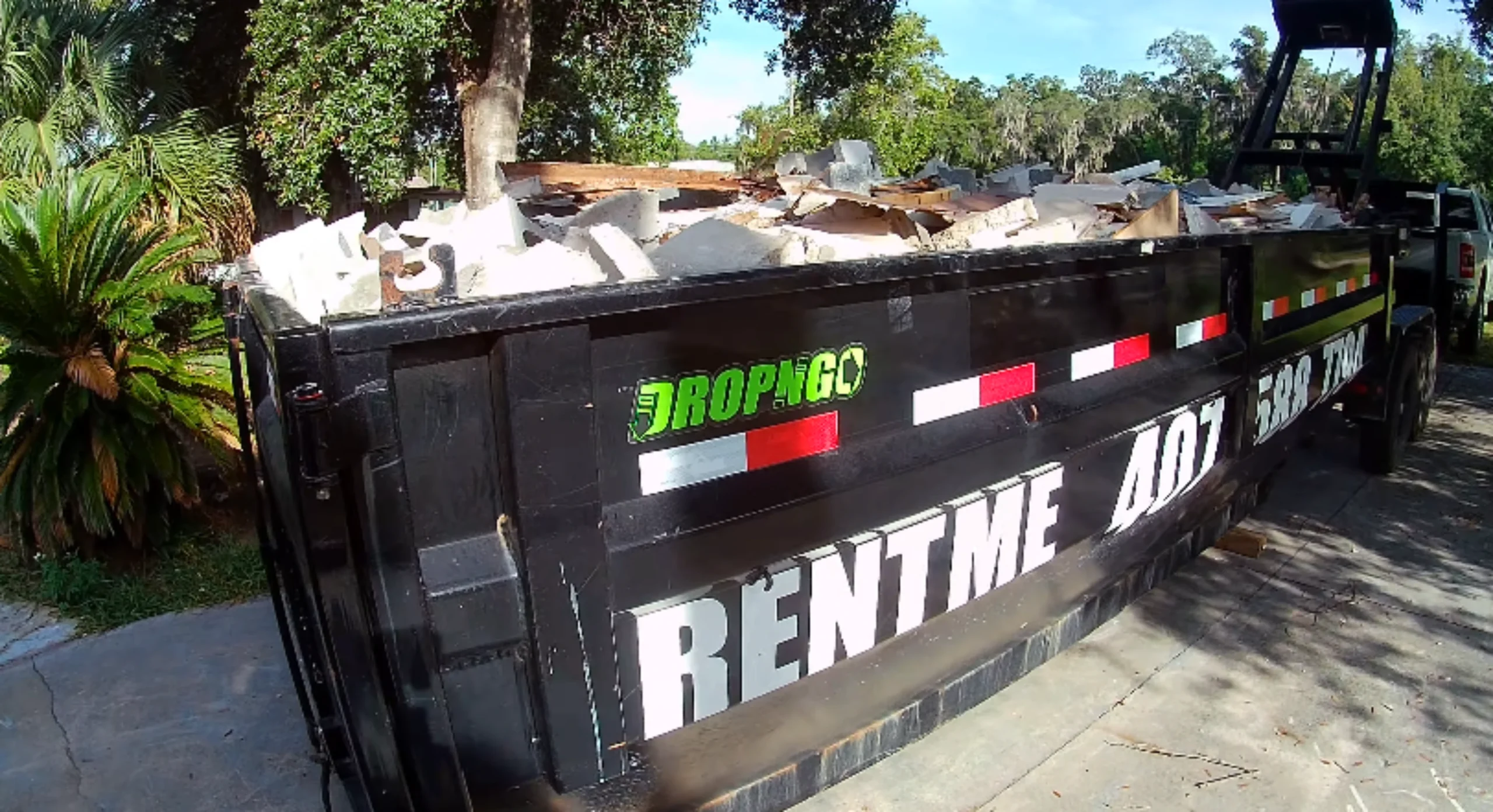 Roll-off dumpster delivered to residential driveway — dumpster rental Owensboro KY same-day service
